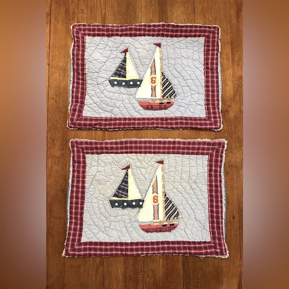 Two pottery barn kids pillow quilted shams, 20”x27”, back of one is sun faded.